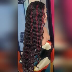 Wowfactor loose wave black hd lace front wig with burgundy highlights.